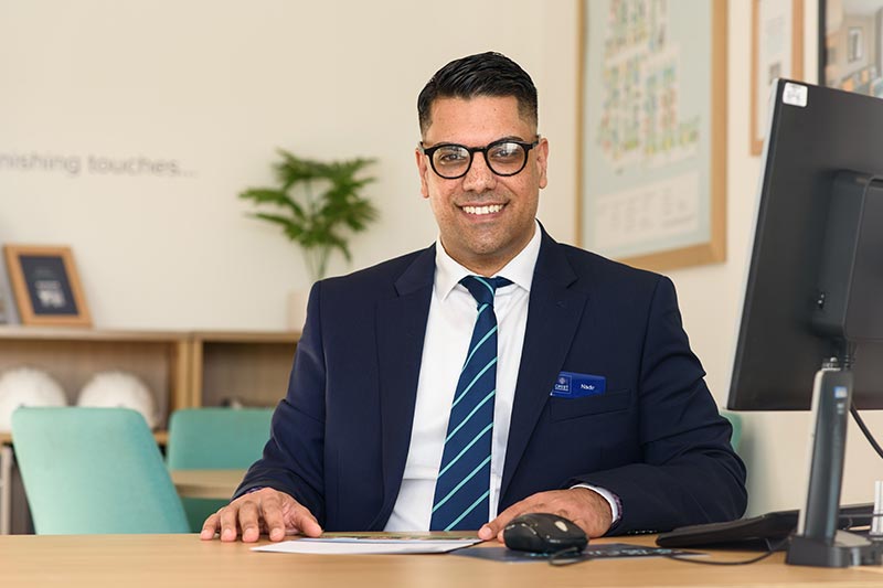 Crest nicholson Employee at desk