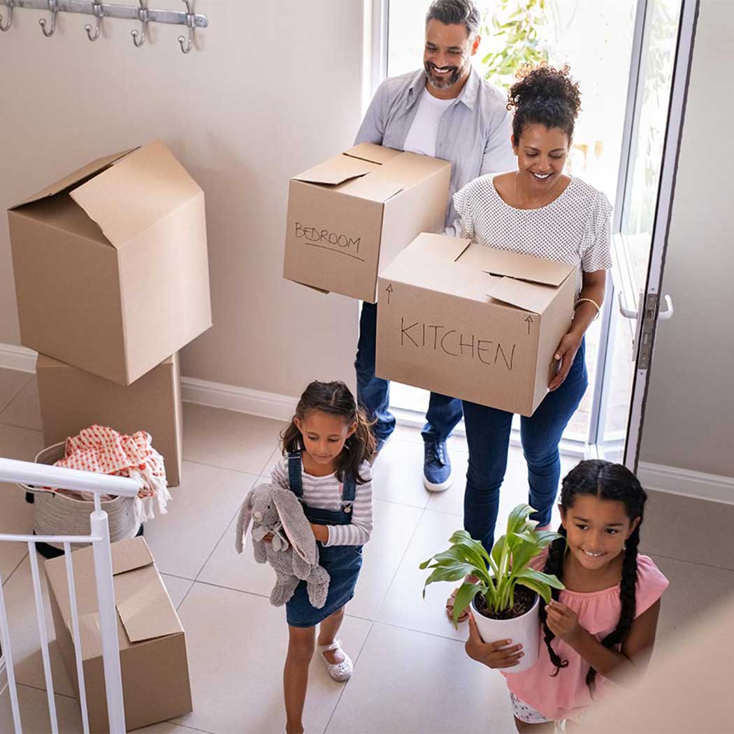Family walking into their new crest nicholson home