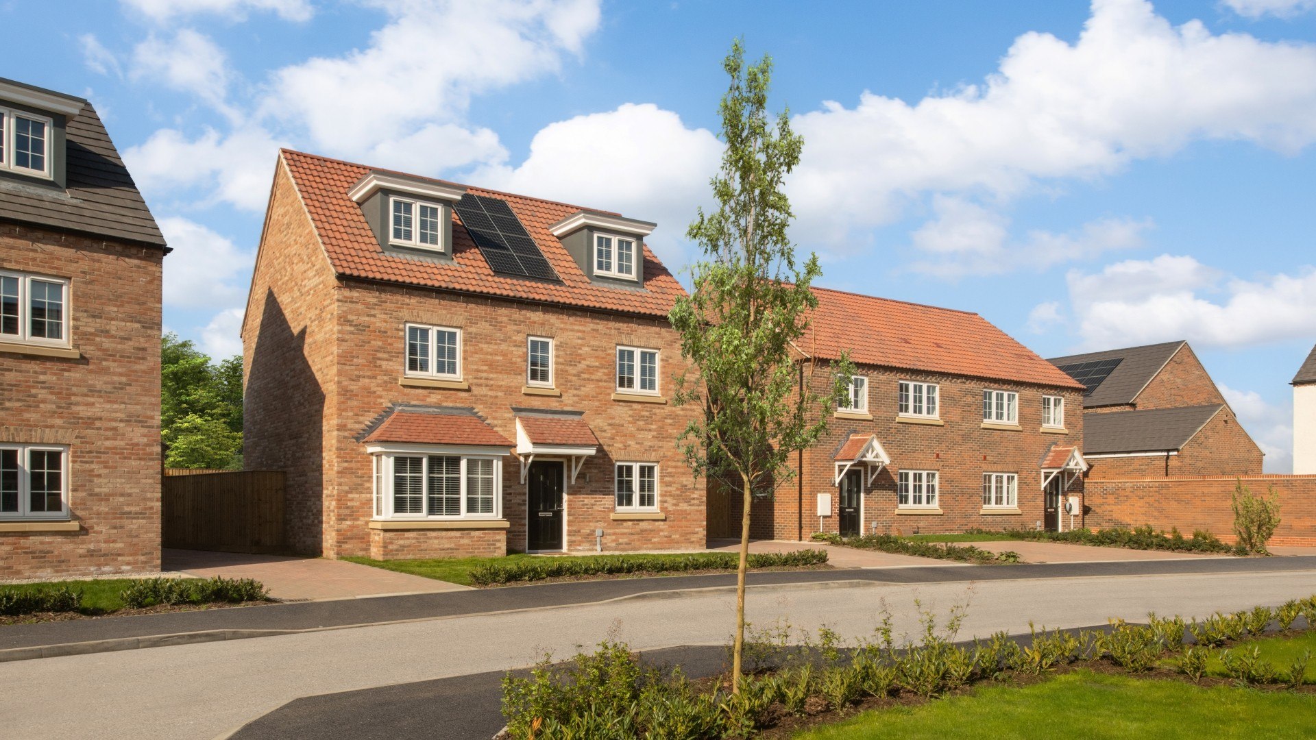 A tranquil street of modern new homes at Copley Park in Sprotbrough, surrounded by greenery.