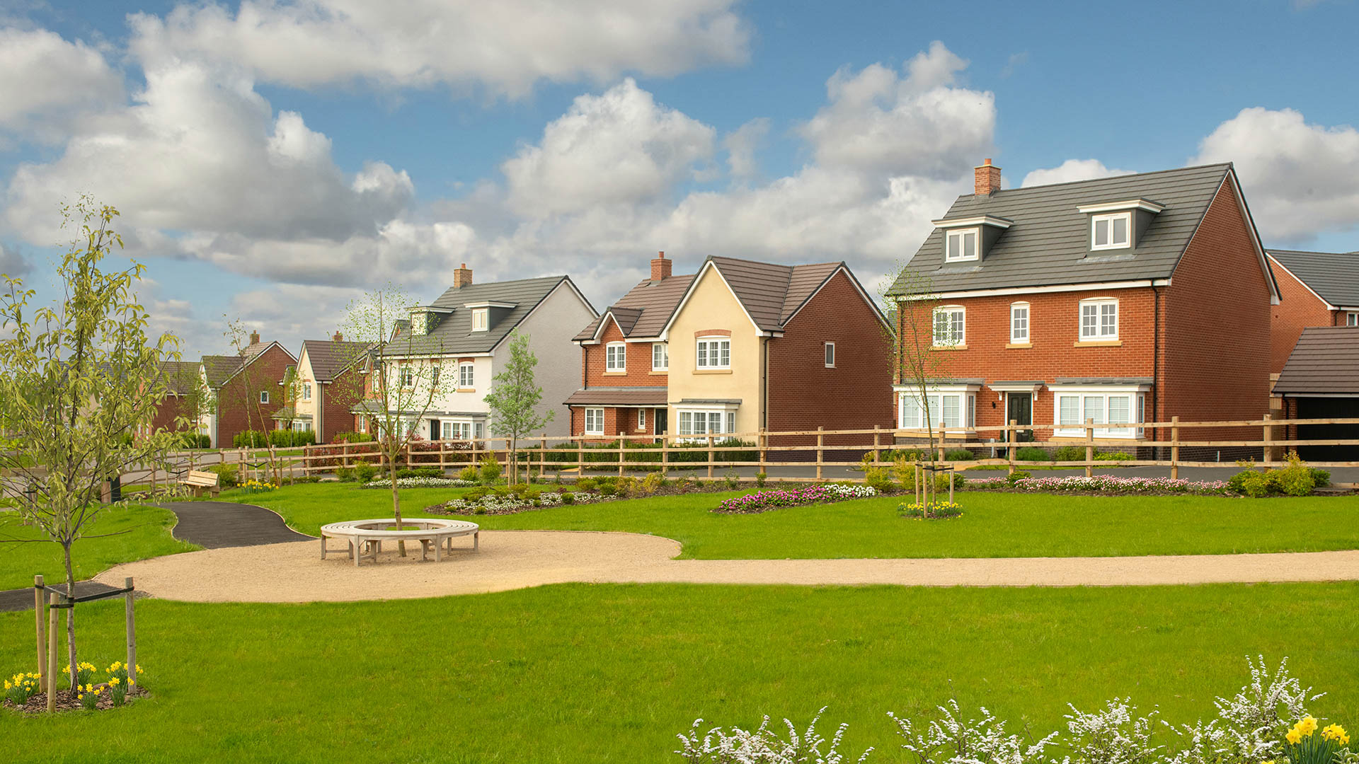 Street scene photography taken at Westwood Park - featuring detached home overlooking green open space.