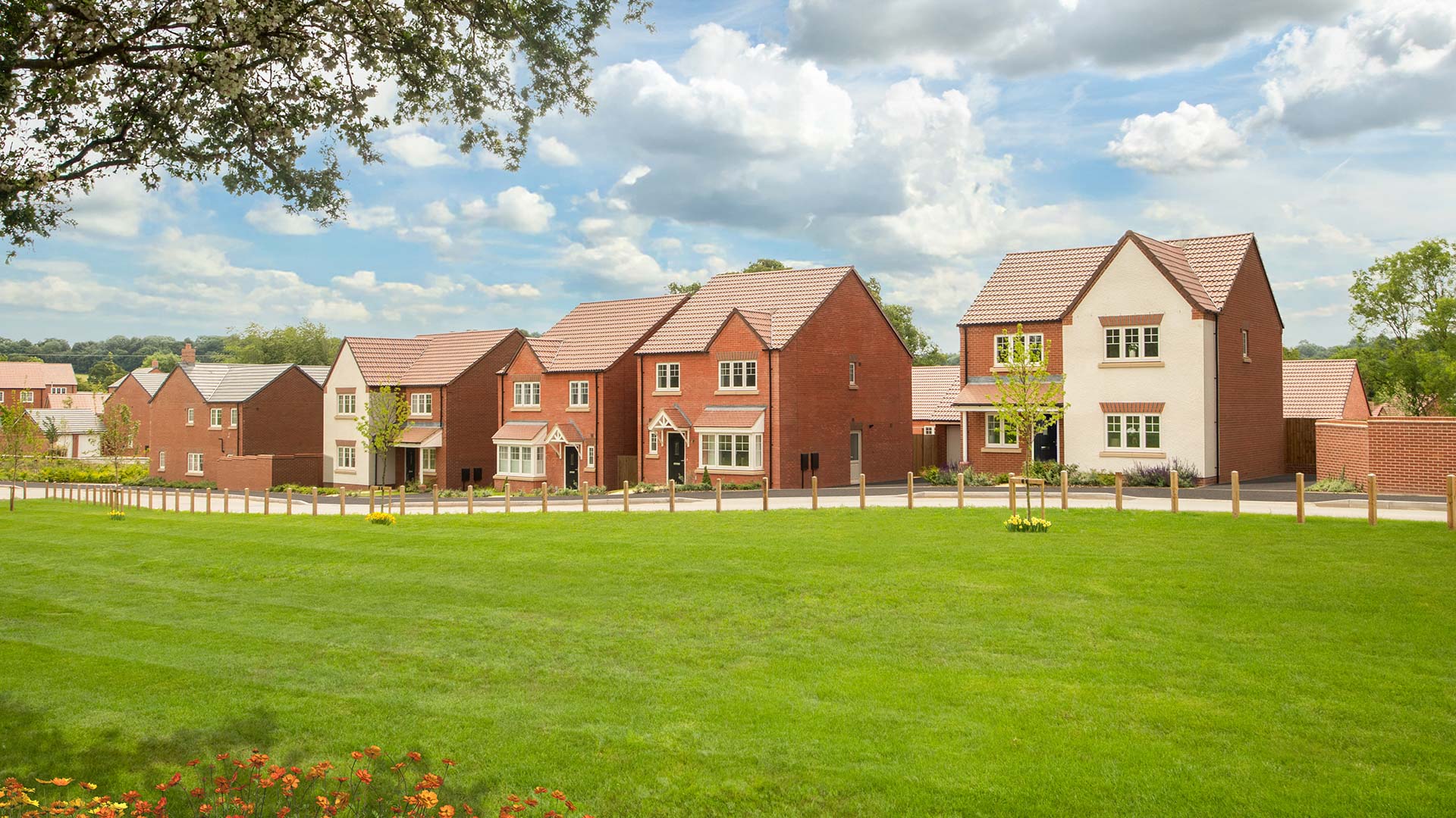 Street scene photography taken at Ludlow Green - featuring detached homes overlooking green open space.