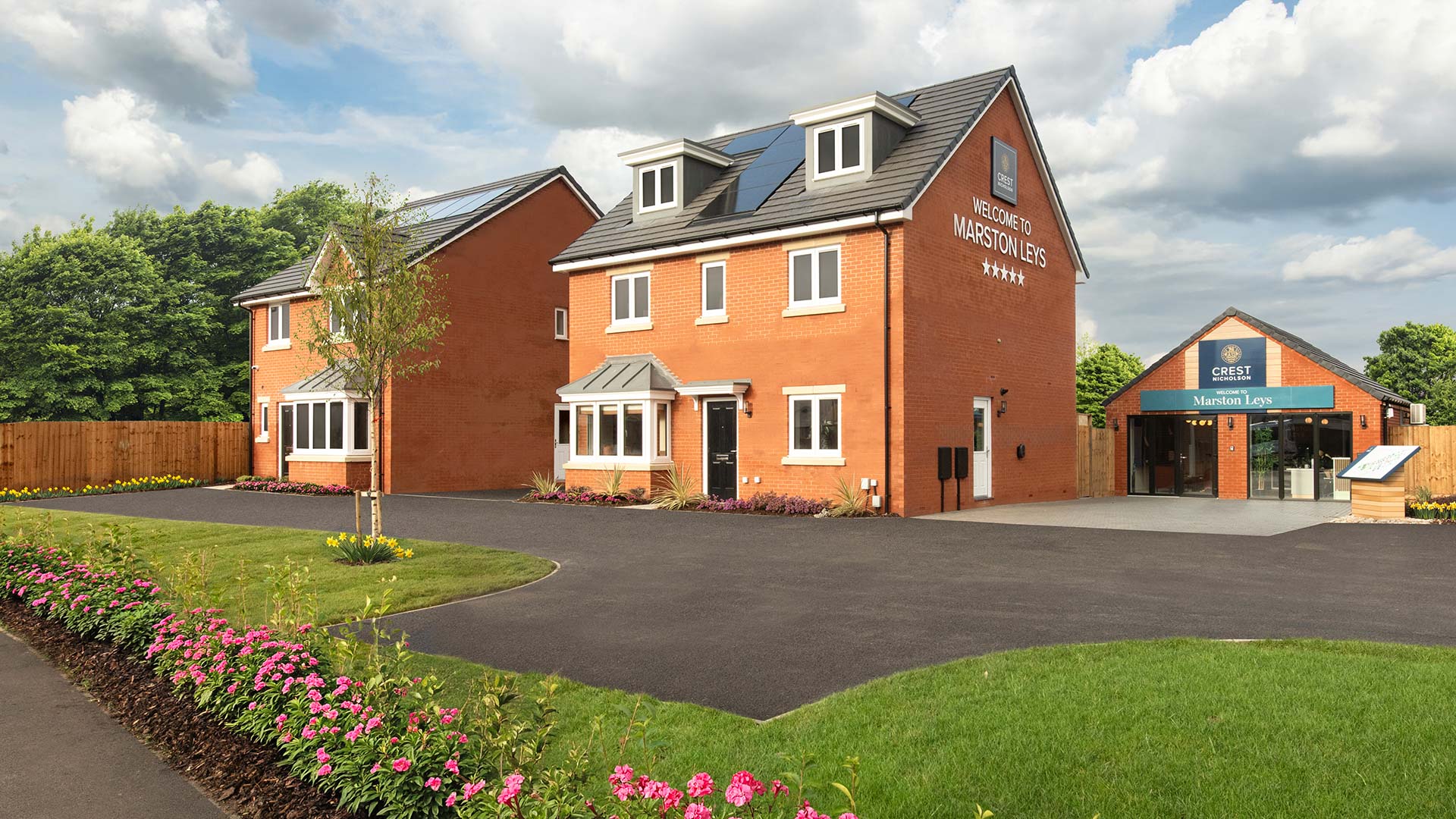External of the Windsor Show home, Romsey behind the home and sales office at Marston Leys