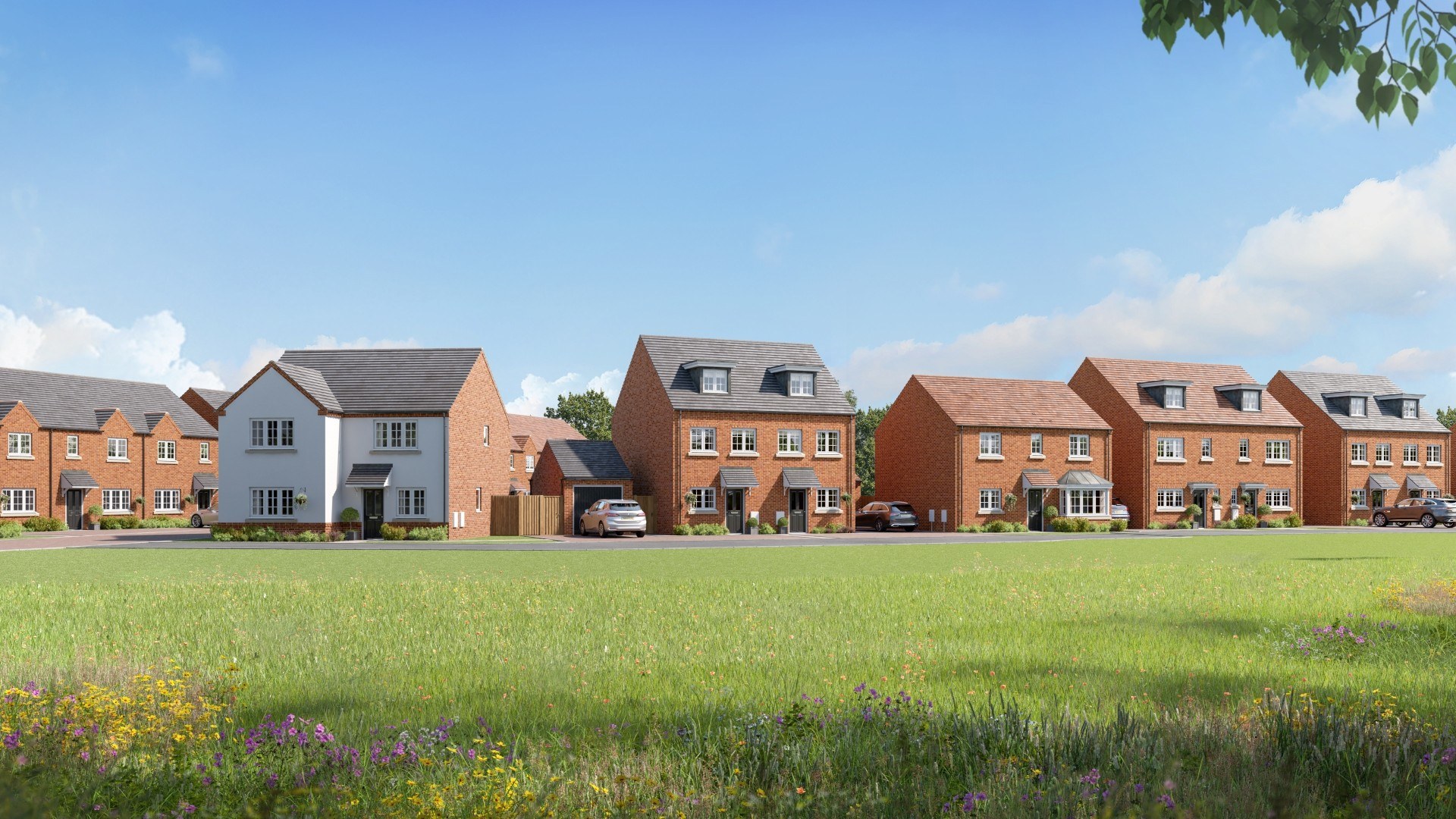 View of modern 2–4 bedroom new build homes at Dalton Gardens in Dalton, Huddersfield, shown across landscaped green space in West Yorkshire.