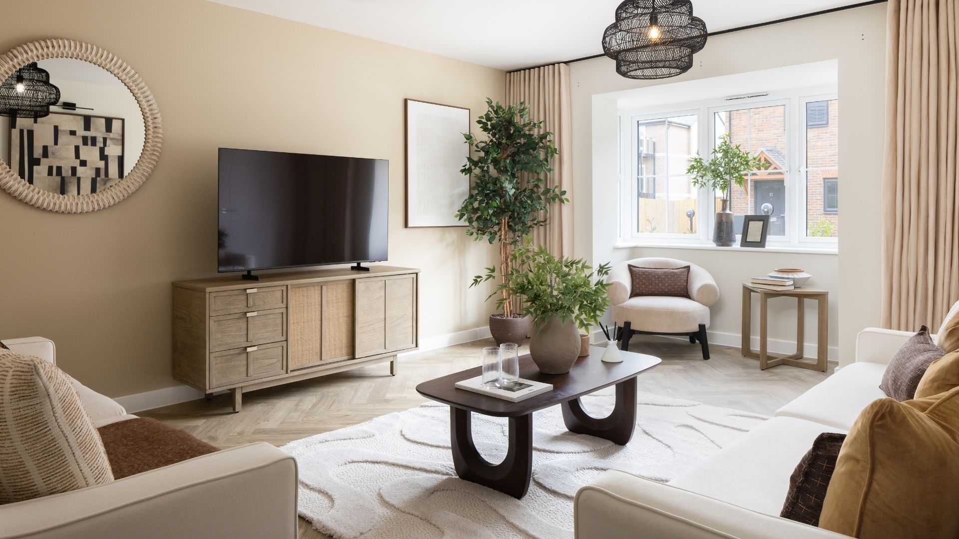 Bright contemporary living room in a typical Crest Nicholson home, styled with modern furnishing, soft neutral tones and a relaxing space ideal for everyday family living.