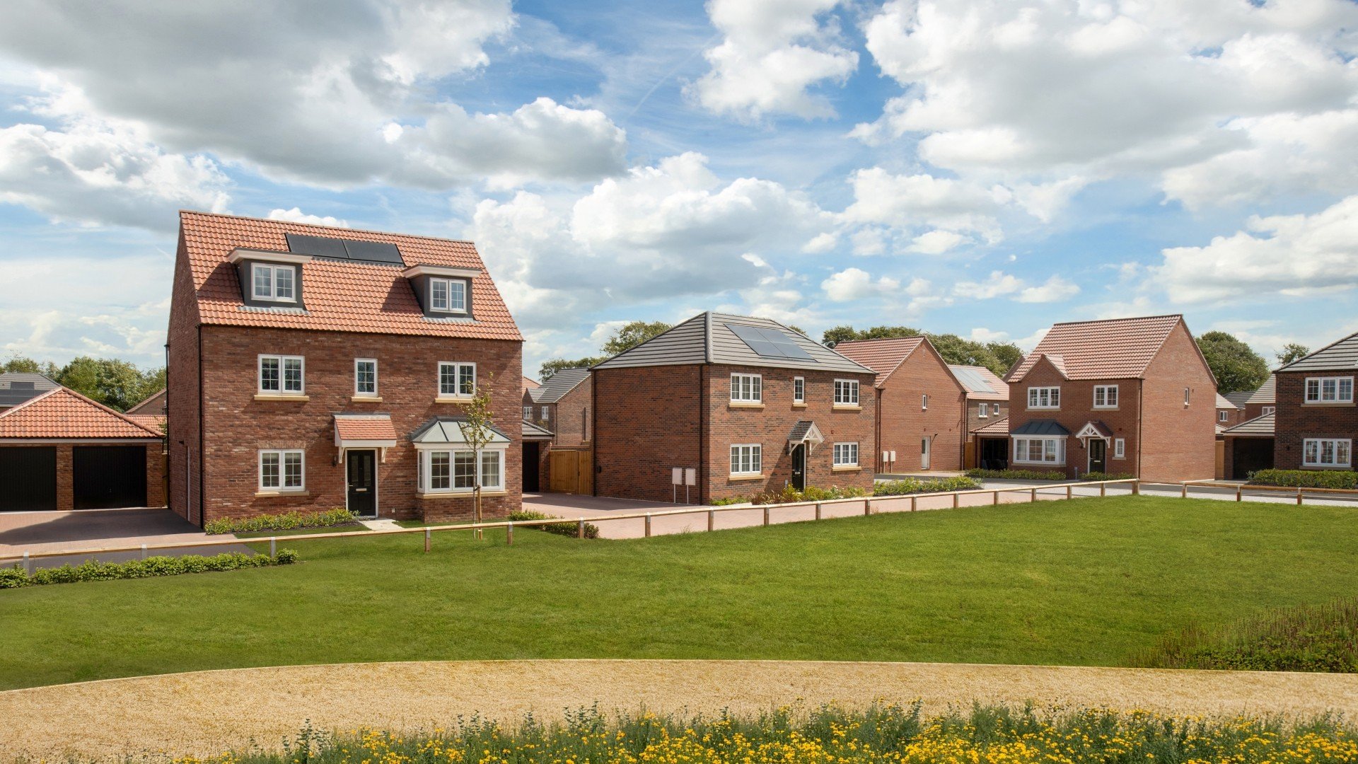 Street scene at Cygnet View showing a mix of detached homes