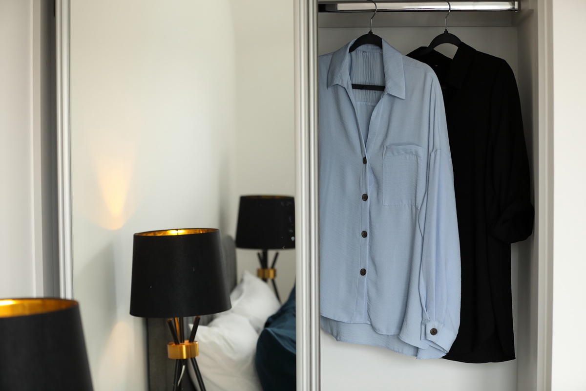 Built-in wardrobe in the bedroom 1 showcasing a modern storage solution for organising clothes at a Chapel House apartment in Potter’s Grange.