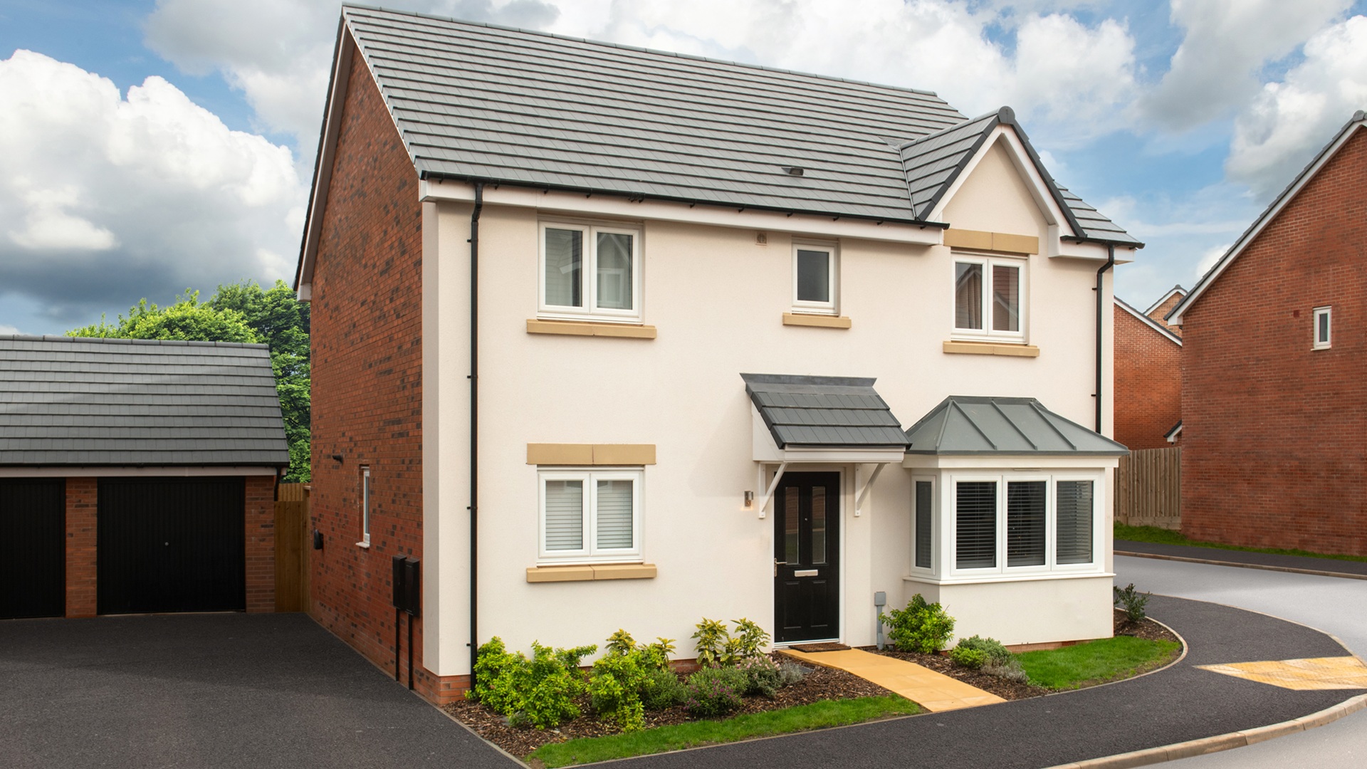The Winslow house type at Sketchley Gardens, a contemporary detached rendered home with landscaped frontage,  drive and garage.