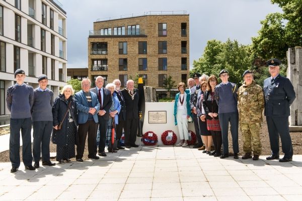 Group gathered at memorial for Charles Sydney