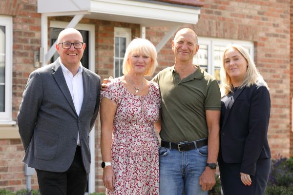Simon Utley, Mr and Mrs Hudson and Rebecca Simmons standing outside property