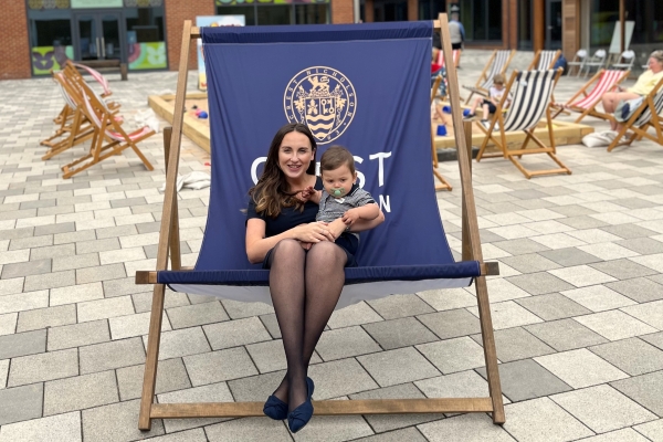 Lady with baby sitting in giant deckchair
