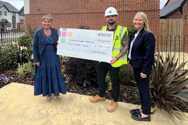 Hunts grove site team presenting cheque to charity